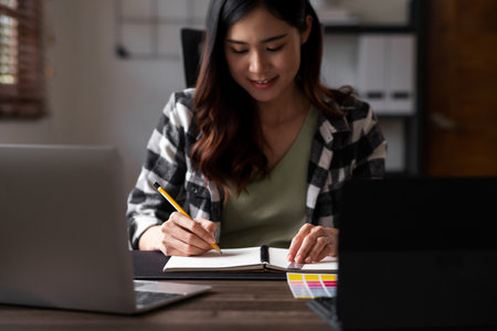 Graphic designer working with sketching logo design at office