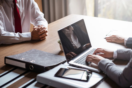 age of employer or recruiter holding reading a resume during about colloquy his profile of candidate