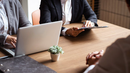 age of employer or recruiter holding reading a resume during about colloquy his profile of candidate