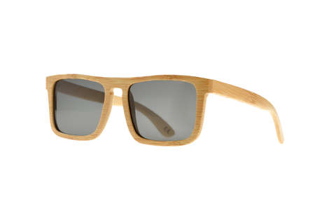 Wooden light brown sunglasses with gray glasses on white backgroundの写真素材