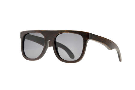 Wooden brown sunglasses with gray glasses on white backgroundの写真素材