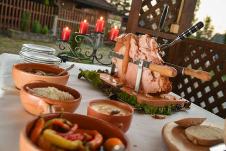 Pork leg with sauces for a banquetの写真素材