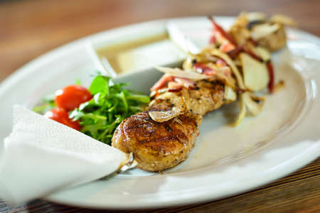 Grilled beef shishkabobs on table close upの写真素材