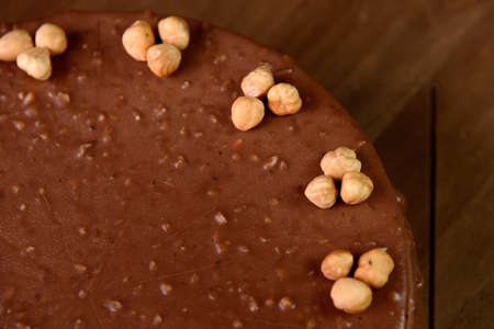 Hazelnut chocolate cake macro of hazelnut on wooden tableの写真素材