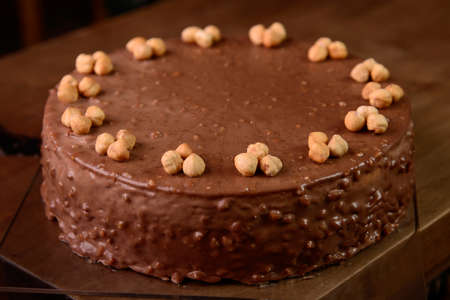 Hazelnut chocolate cake macro of hazelnut on wooden tableの写真素材