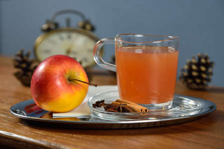 Spicy hot pear or apple cider with cinnamonの写真素材