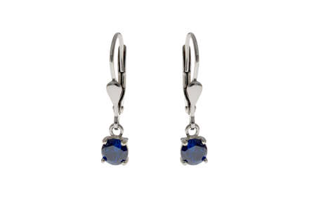 Earrings in the ears jewelry made of silver and gold with crystalsの写真素材