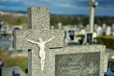 Cemetery with tombstones in the shape of a cross, angels. Many decorated gravesの写真素材