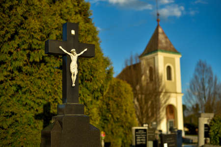 Cemetery with tombstones in the shape of a cross, angels. Many decorated gravesの写真素材