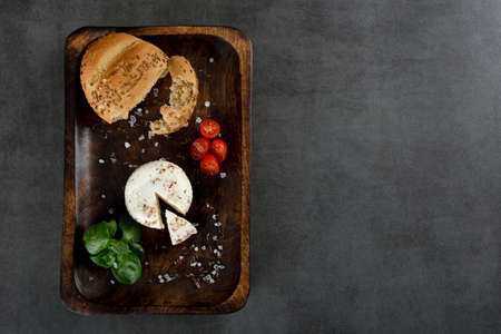 Raw Organic White Feta Cheese for Crumbling on dark stone backgroundの写真素材