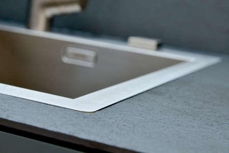 Stainless steel kitchen sink in a modern styleの写真素材