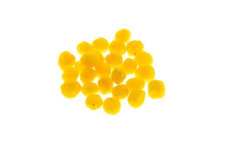 Close up view of yellow boilies, fishing baits for carp isolated on white backgroundの写真素材
