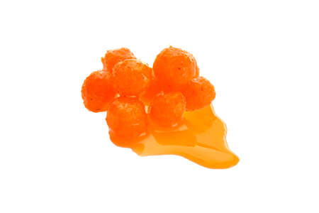 Close up view of orange boilies in dip, fishing baits for carp isolated on white backgroundの写真素材