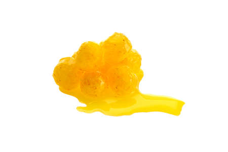 Close up view of yellow boilies in dip, fishing baits for carp isolated on white backgroundの写真素材
