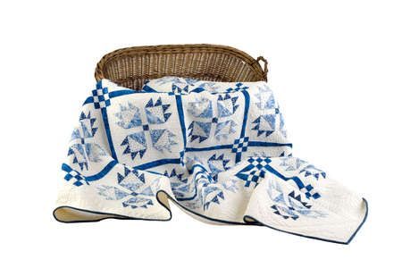 Patchwork white-blue quilt on a white background. Patchwork blanket. Handmade. Patchwork quilt on a white background.の写真素材