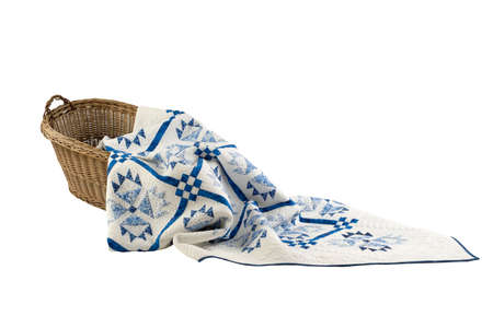 Patchwork white-blue quilt on a white background. Patchwork blanket. Handmade. Patchwork quilt on a white background.の写真素材