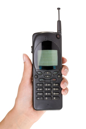 Hahd take old mobile phone isolated on white backgroundの写真素材