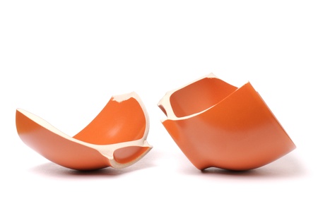 Broken orange plate isolated on white background