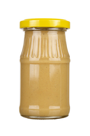 Mustard glass bottle. Isolated on white backgroundの写真素材