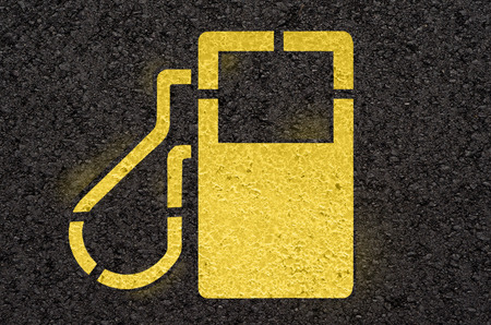 Asphalt road with gas station signの写真素材