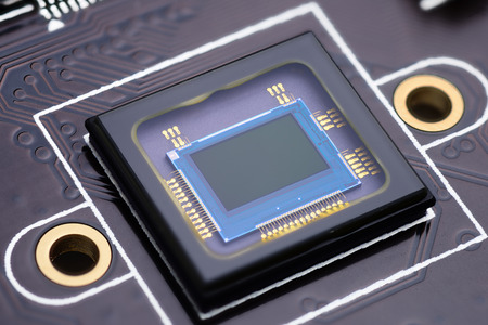 Security camera censor chip on electronic circuit board. Macro shot