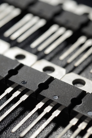 Macro shot of power transistors on the black surfaceの写真素材