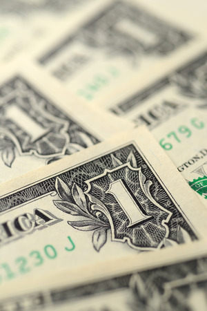 Fan or heap of one dollar bills macro shot