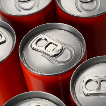 Group of red aluminum soda or cola cans top view