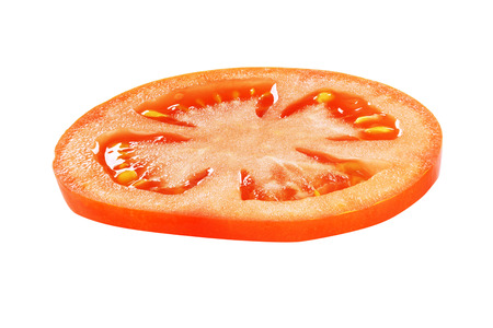 Red tomato slice side view isolated on white backgroundの写真素材