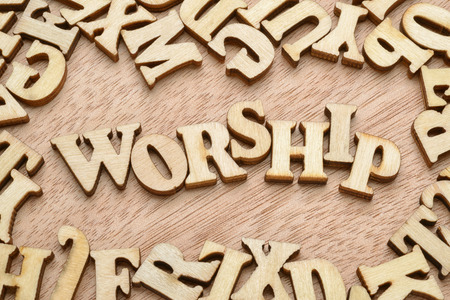 Worship word made with wooden letters. Praying or religion conceptの写真素材