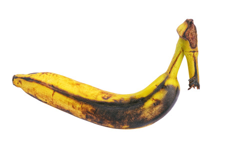 Rotten brown overripe banana isolated on white backgroundの写真素材