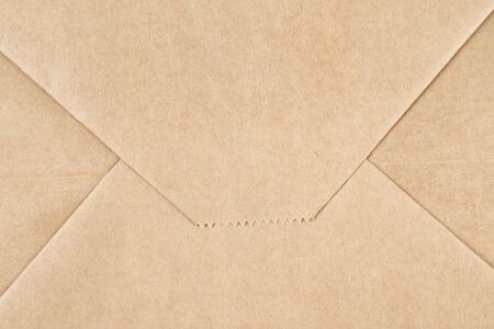 Brown craft paper texture or background folded as envelope. Top view. Macro shotの写真素材
