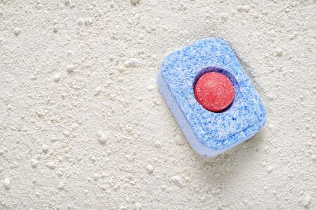 Dishwasher detergent tablet and powder. Choice concept. Copy spaceの写真素材