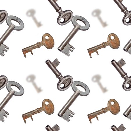 Old rusty keys on white background seamless texture or patternの写真素材