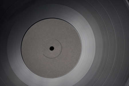 12-inch LP vinyl record with blank black label. Close-up shot, top view