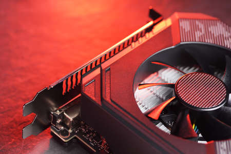 Computer gaming GPU graphic card with fan close-up macro shot.