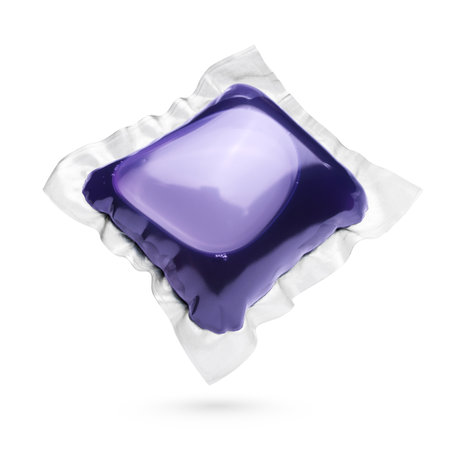 Green colored laundry detergent pod isolated on white backgroundの写真素材