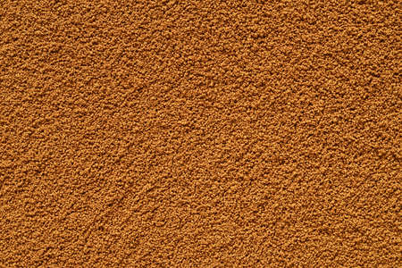 Dry brown instant coffee texture or background macro shot.の写真素材