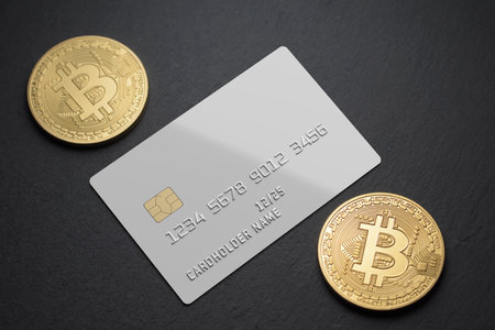 White blank plastic card with bitcoin coins on black background. 3D rendering template mockup.の写真素材