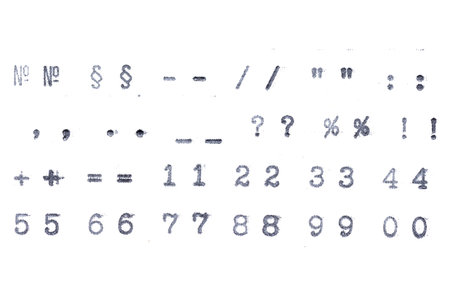 Old vintage font symbols and digits from typewriter isolated on white background.
