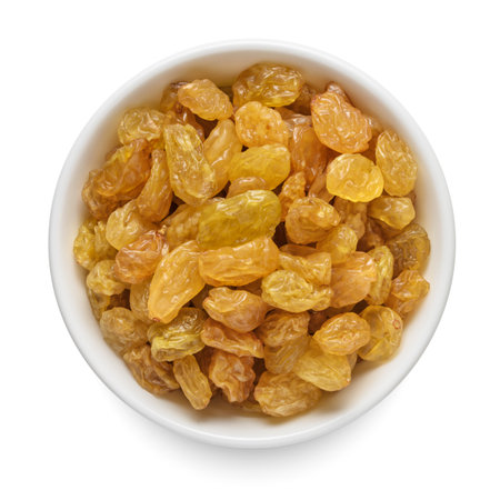 Sultanas raisin in white bowl isolated on white background. Top view.の写真素材