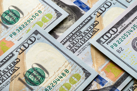 Pile of US one hundred bills. Close-up macro shot.の写真素材