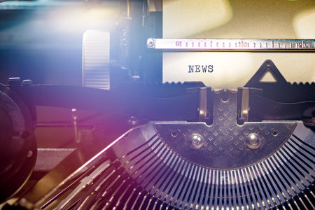 News typed words on a vintage typewriter. Close up shot of simple and powerful message.