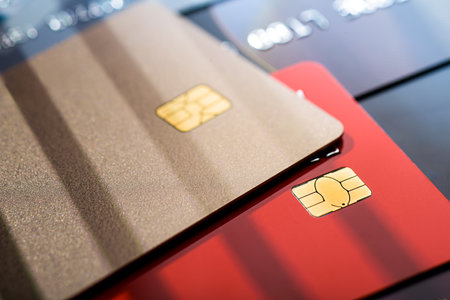 Stack of different credit cards, close up view with selective focus. Plastic card payment.の写真素材