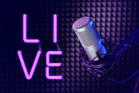 Professional microphone in the sound recording studio with LIVE neon sign.の写真素材