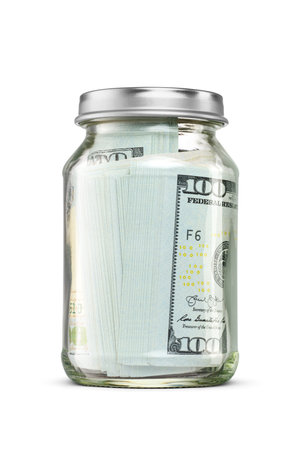 Hundred US dollars cash bundle in glass jar isolated on white background.の写真素材