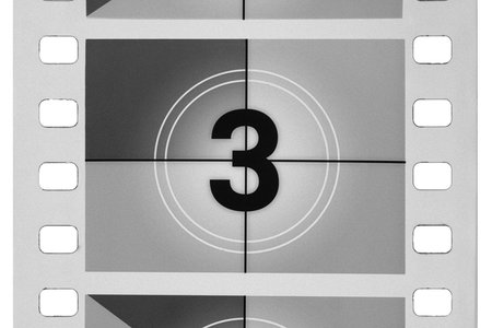 Classic film leader countdown with number three on screen, creating a vintage cinema concept,...