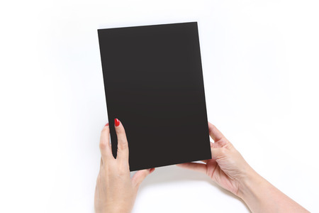 Hands Holding catalog on a white backgroundの写真素材