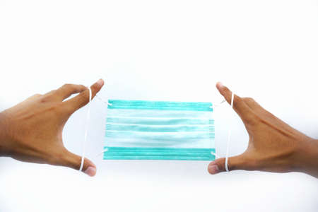 Medical mask on hand. Protect from dust and covid-19 virus.