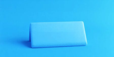 Light blue rectangular object on a bright blue background Clear details and vibrant colors enhance...の素材